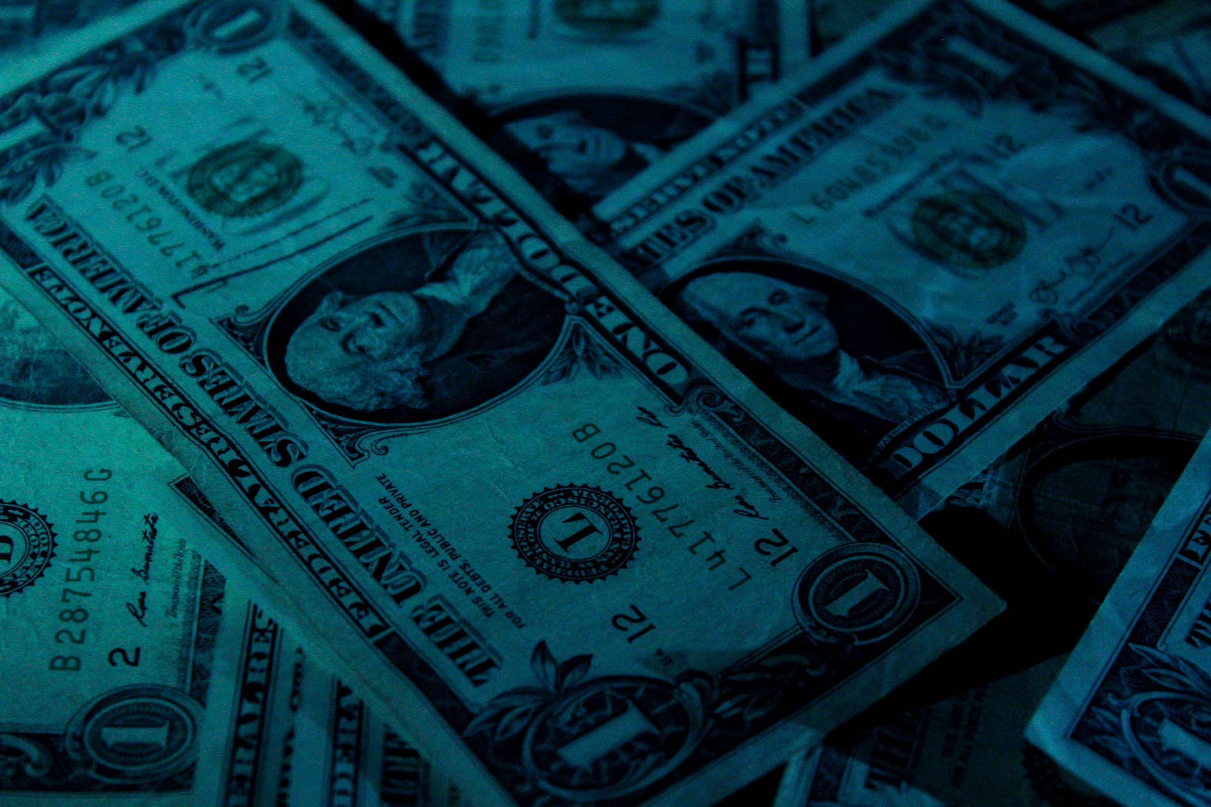 one dollar bills - How Much Does It Cost to Build a Shopify Website