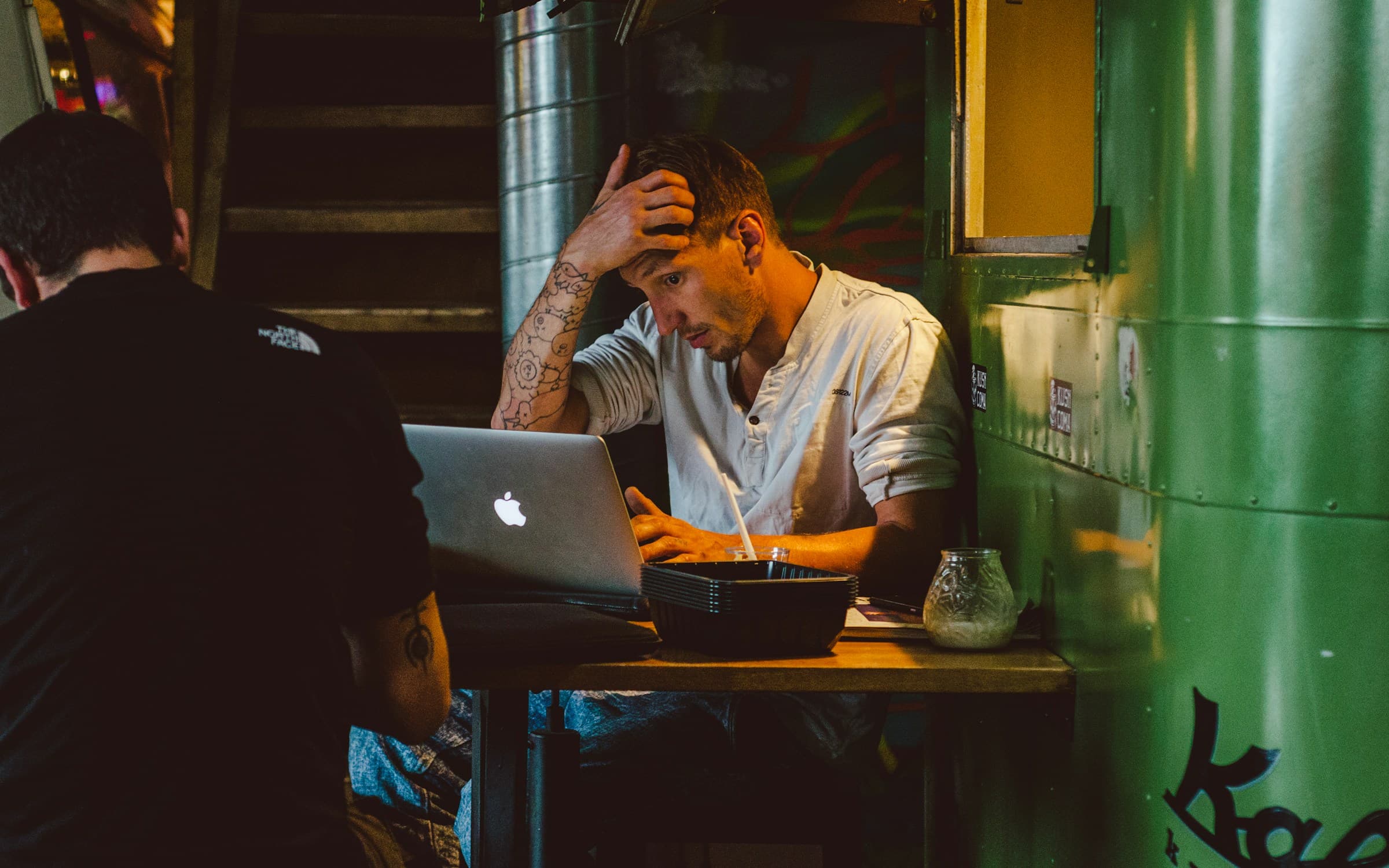 man paying money - How Much Does It Cost to Build a Shopify Website