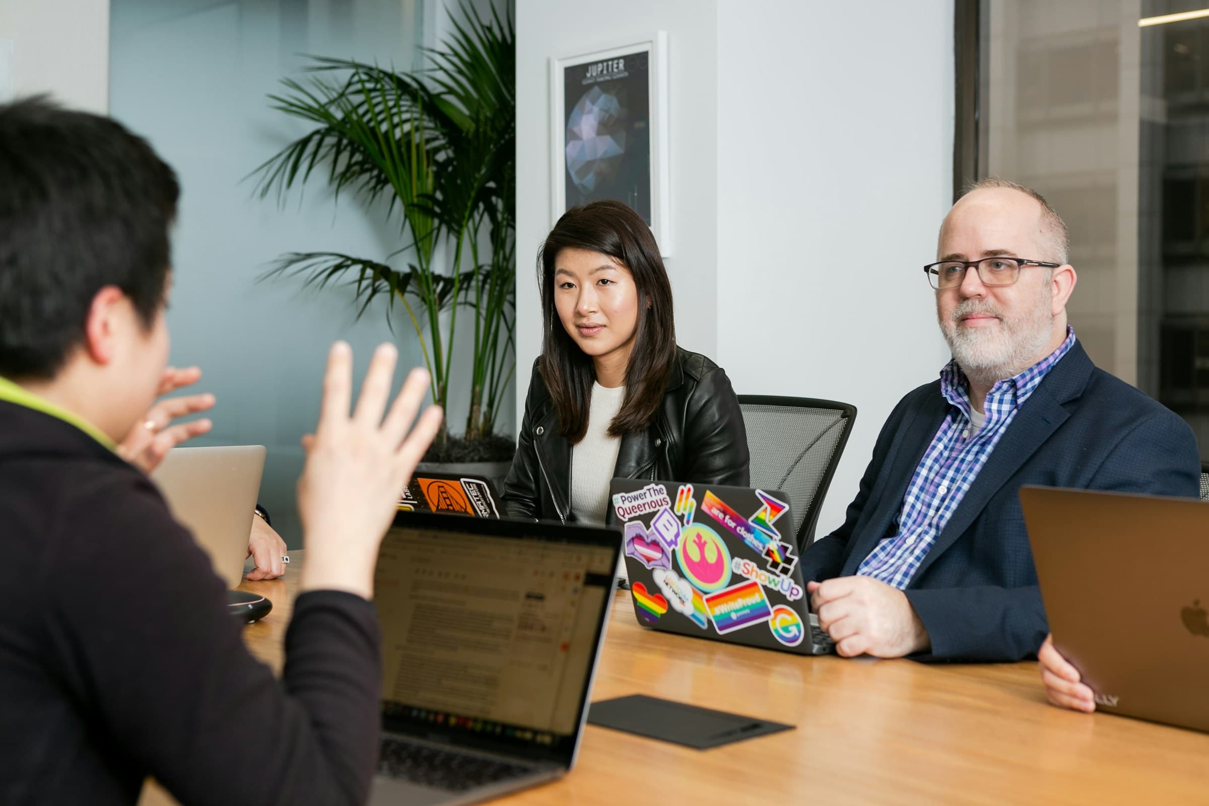 team discssing considerations - Shopify Delete Page Template