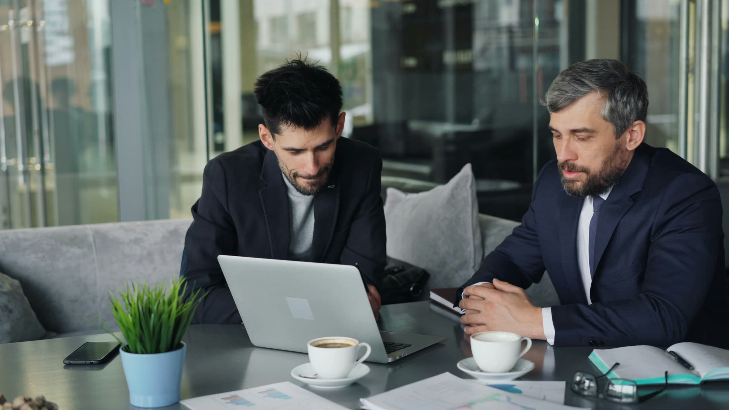 man in discussion with senior dev - Shopify Landing Pages