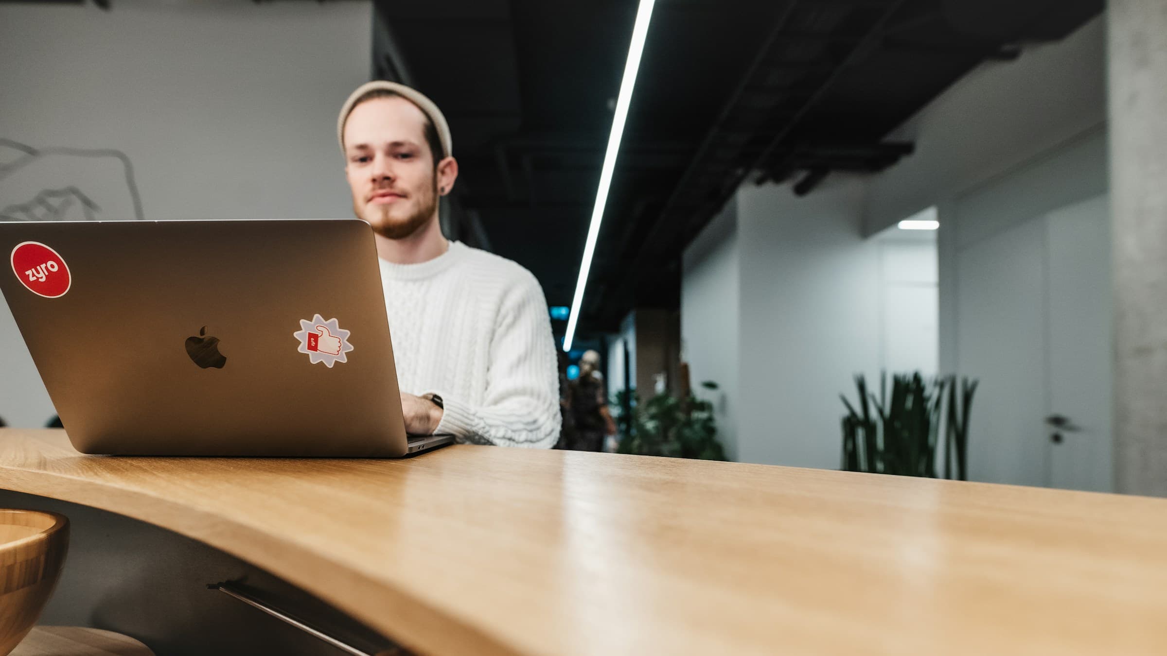 person sitting in an office - Shopify Pages